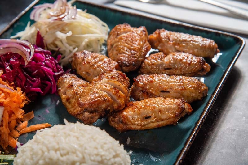 Chicken wings with rice and salad
